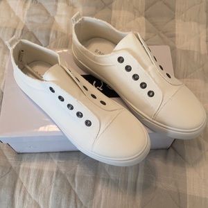 All white slip on sneakers